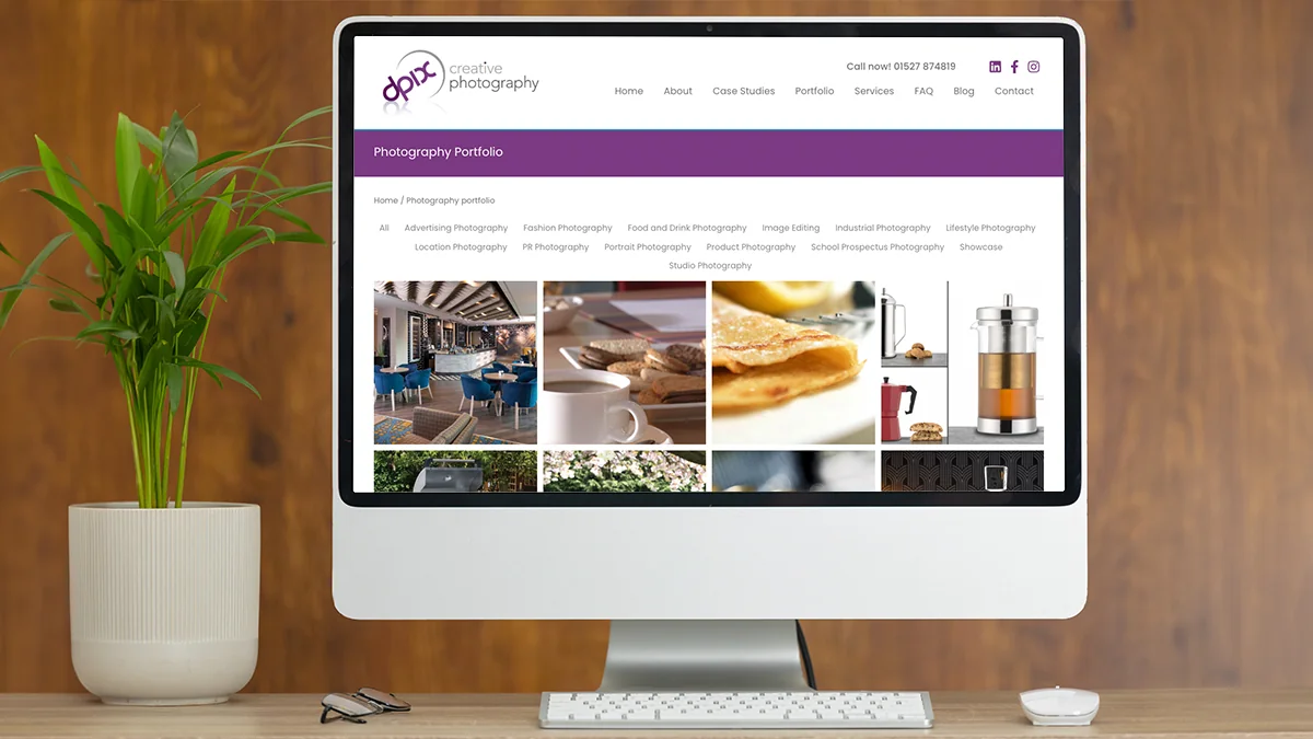 dpix Creative Photography portfolio website displayed on a desktop monitor